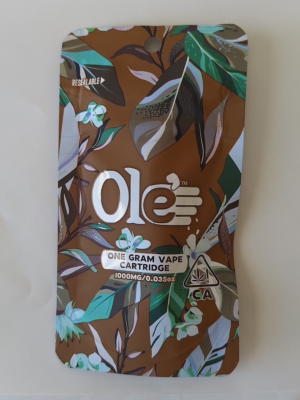 A real California-licensed one-gram vape cartridge package, showing the CA universal cannabis symbol in the lower right